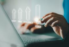 A person types on a laptop with glowing holographic arrows showing increased quality, speed, and efficiency and reduced cost.