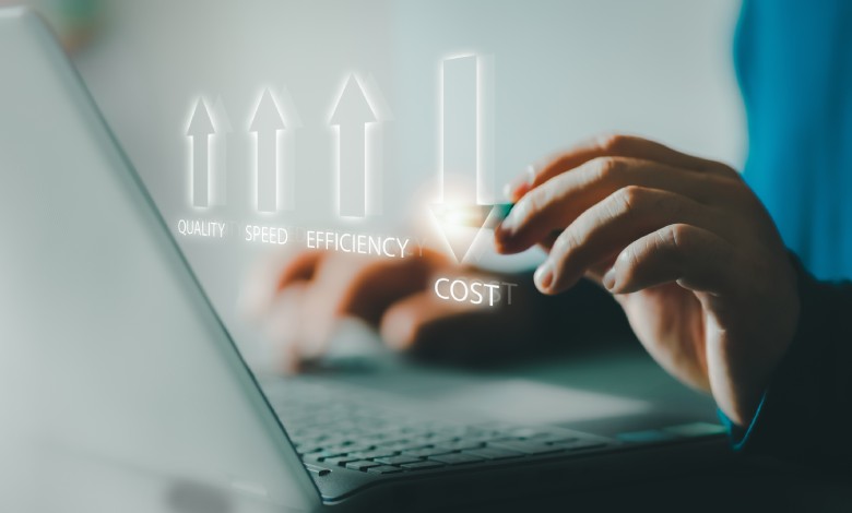 A person types on a laptop with glowing holographic arrows showing increased quality, speed, and efficiency and reduced cost.